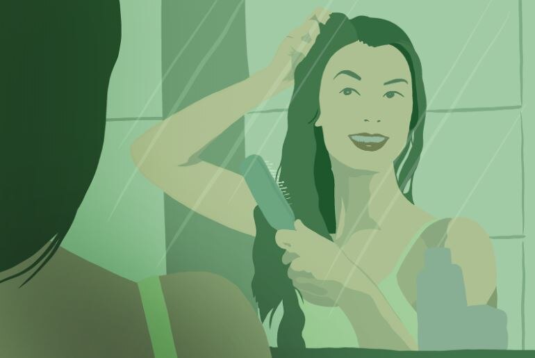 girl looking in a mirror